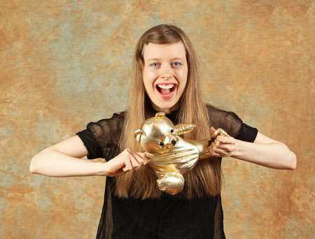 Teddy bear torn apart by a girlの写真素材