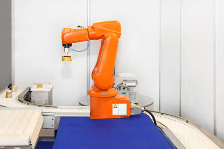 Robotic arm at automated factory production lineの写真素材