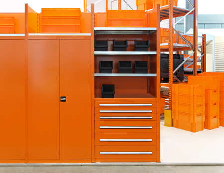 Orange shelving system for storage in warehouseの写真素材
