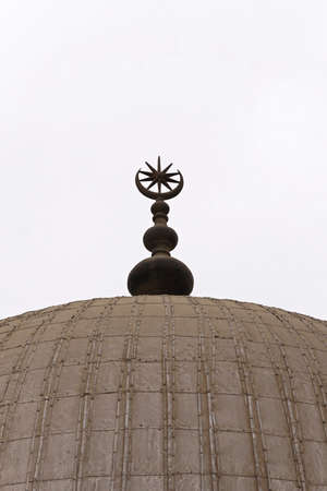 Mosque dome with star and crescent at top