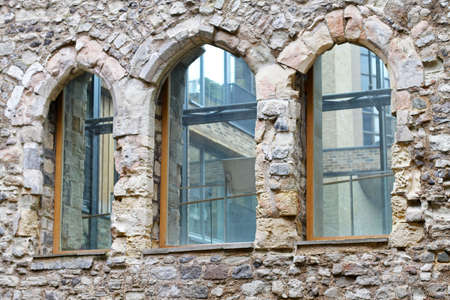 Closeup architecture detail with windows on stone house