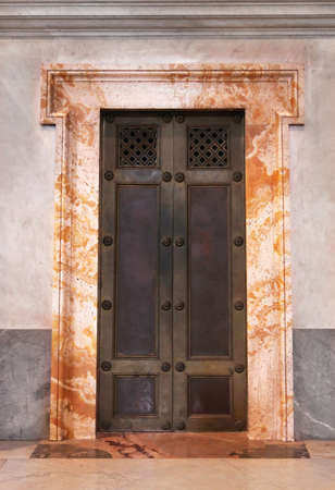 Armored iron door with marble frame in Vaticanの写真素材