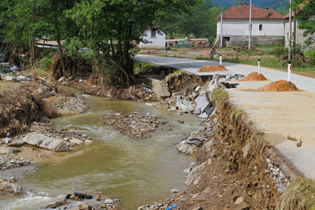 River flow calmed down after powerful flooding distructionのeditorial素材