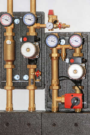 Central heating unit with pump valves and gauges