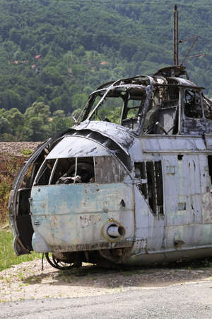 Damaged crashed helicopter after fire in cabinの写真素材
