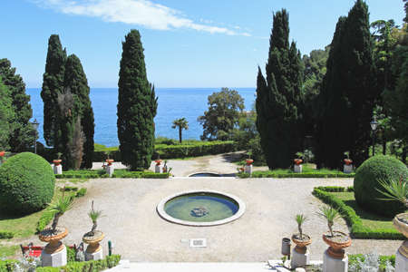 Mediterranean style garden with pond in parkの写真素材