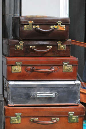 Big pile of vintage suitcases and briefcasesの写真素材