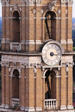 Analog clock at tower in Romeの写真素材