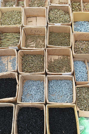 Boxes of screws for wood in hardware shop