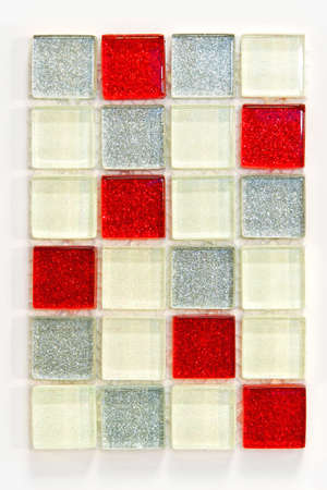 Small glass square tiles in red white and silverの写真素材