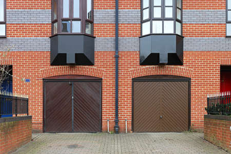 Closed garage doors outside of residential buildingの写真素材