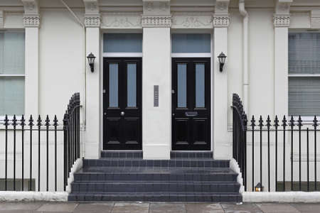 Two black doors at Victorian house in Londonの写真素材