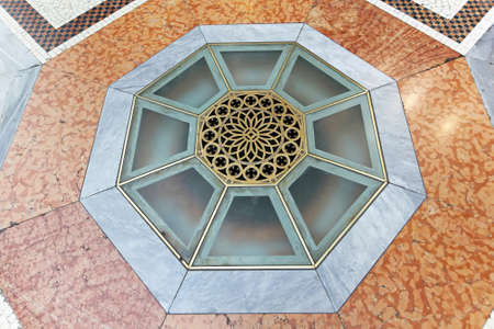 Decorative floor window with brass details