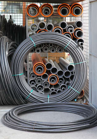 Hoses and pipes at shelf in warehouse