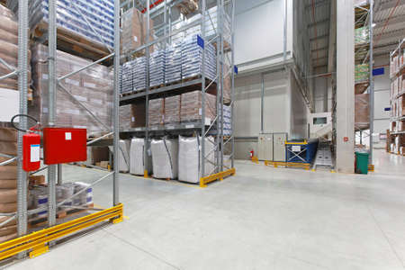 Shelves with food in distribution warehouse