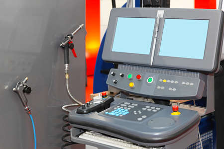 Machine control panel with two monitors