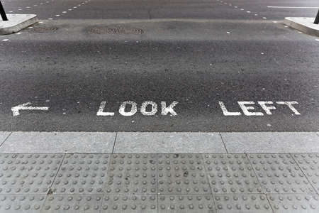 Look left safety sign at street crossing in London