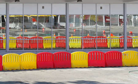 Red and yellow plastic traffic barrier dividersの写真素材