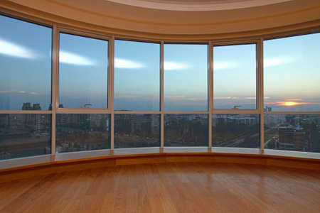 Big glass wall with cityscape view