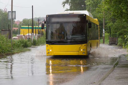 Yellow bus in flooded street Belgrade