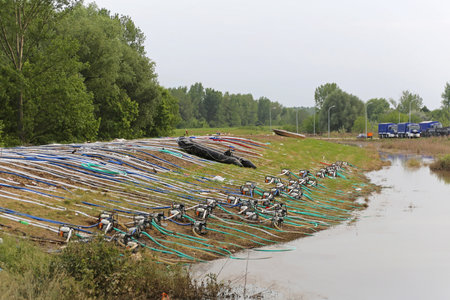 OBRENOVAC, SERBIA - MAY 24  Levee with pumps in Obrenovac on MAY 24, 2013  Pumping water at levee in...
