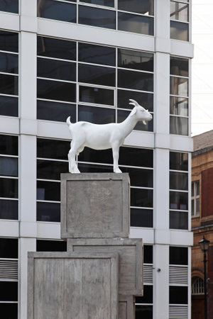 LONDON, UNITED KINGDOM - NOVEMBER 20  I Goat sculpture in London on NOVEMBER 20, 2011  White goat standing at pile of crates at Spitalfields in London, United Kingdom のeditorial素材