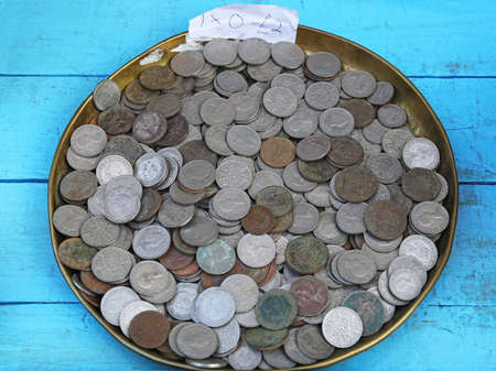 Bunch of various old coins at flea marketの写真素材