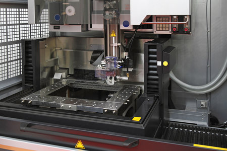 Electrical discharge machine spark eroding with wire