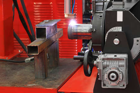 Automated robot welding gas pipe in workshop