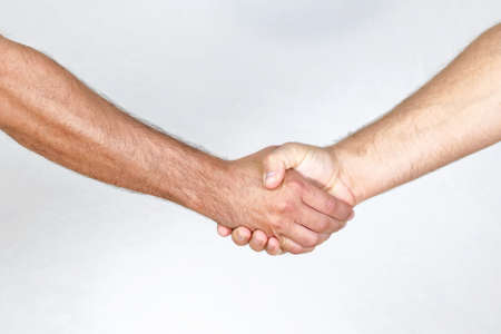 Two man handshake with hairy handsの写真素材