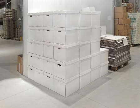 White transport boxes in distribution warehouse