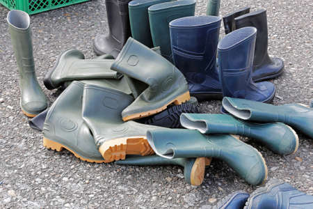 Bunch of rubber Wellington boots outdoor wear