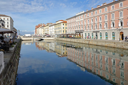 TRIESTE, ITALY - OCTOBER 14: Grand canal in Trieste on OCTOBER 14, 2014. Waterway with palace buildings in downtown Trieste, Italy.のeditorial素材