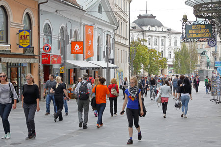LJUBLJANA, SLOVENIA - OCTOBER 13: Pedestrians at Copova street in Ljubljana on OCTOBER 13, 2014. People walking at pedestrian zone in Ljubljana, Slovenia.のeditorial素材