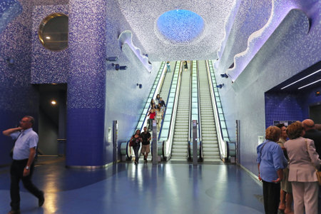 NAPLES, ITALY - JUNE 25: Toledo Metro Station in Naples on JUNE 25, 2014. Escalators with commuters in Toledo Art station designed by Spanish Architects Firm Oscar Tusquets Blanca in Naples, Italy.のeditorial素材