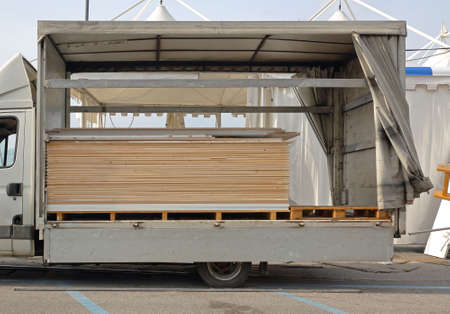Plywood boards at truck ready for unload to construction site