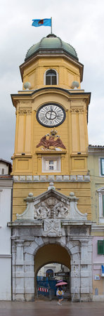 RIJEKA, CROATIA - OCTOBER 17: Clock tower and CIty Gate in Rijeka on OCTOBER 17, 2014. Landmark tower at Korzo street in downtown Rijeka, Croatia.のeditorial素材