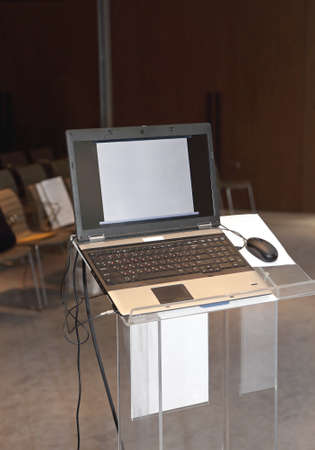 Business Laptop Computer at Podium in Seminar Conference Roomの写真素材