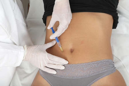 Woman Having Belly Treatment at Beauty Clinicの写真素材