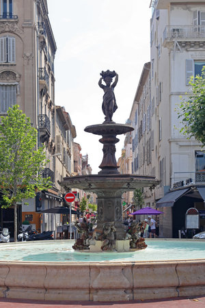 CANNES, FRANCE - JULY 12: Fountain with statue in Cannes on JULY 12, 2013. Woman statue in fountain at place du General de Gaulle street in Cannes, France.のeditorial素材
