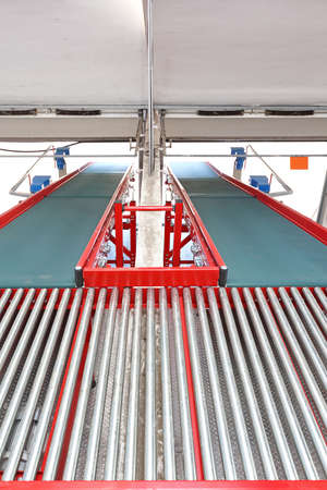 Two Conveyor Belts at Ramp in Distribution Warehouseの写真素材