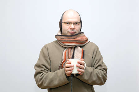 Middle Age Bald Man Holding Cup of Teaの写真素材
