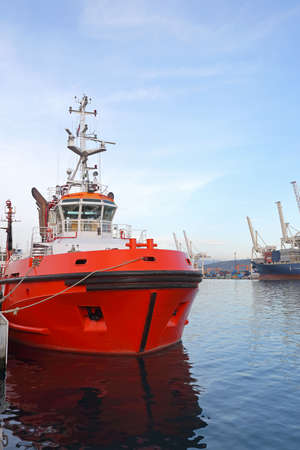 Red Tugboat Industrial Vessel Moored in Port