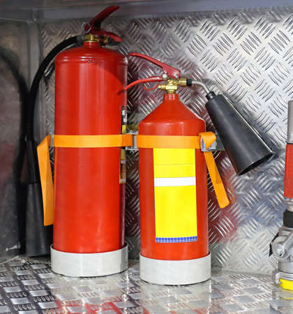 Two Fire Extinguishers in Truck Compartment