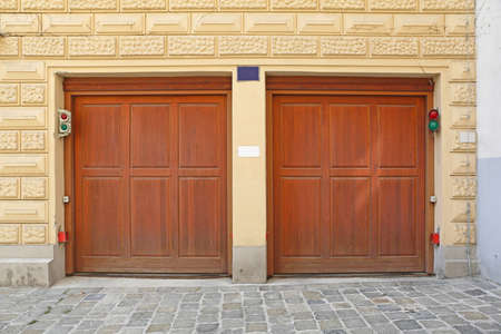 Two Wooden Garage Doors at Houseの写真素材