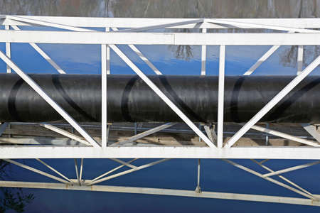 Gas Pipe Line Crossings Bridge Over Riverの写真素材