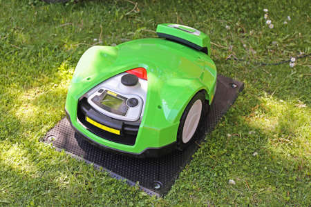 Robotic Lawn Mower at Charging After Cutting Grassの写真素材