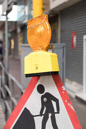 Road Works Sign With Light at Street