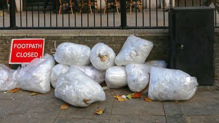 Garbage Bags All Over Closed Footpathの写真素材