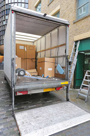 Delivery Truck With Ramp Shipping Goods in Boxes